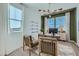 Bright home office with a modern desk, comfortable chairs, and large windows providing ample light at 8331 E Petunia Ave, Mesa, AZ 85212