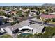 Aerial view of the home showcasing the pool, covered patio, and overall property layout in a residential area at 8441 W Foothill Dr, Peoria, AZ 85383