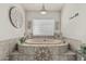 Bathroom with tiled tub and decorative molding at 8441 W Foothill Dr, Peoria, AZ 85383
