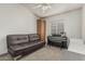 Bedroom featuring a sofa, cabinet, and a piano at 8441 W Foothill Dr, Peoria, AZ 85383