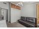 Bedroom featuring a sofa, built-in cabinets, and closet at 8441 W Foothill Dr, Peoria, AZ 85383