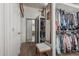 Walk-in closet featuring two sections, with a seating bench in the foreground at 8441 W Foothill Dr, Peoria, AZ 85383