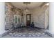 Charming front porch with decorative tile flooring, seating, and stylish accents, creating a welcoming entrance at 8441 W Foothill Dr, Peoria, AZ 85383