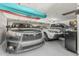 Three cars fitting in garage, epoxy floor, overhead storage for kayaks or similar at 8441 W Foothill Dr, Peoria, AZ 85383