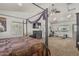 The primary bedroom and gym area features a four-poster bed, fireplace, and workout equipment at 8441 W Foothill Dr, Peoria, AZ 85383