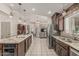 Open concept kitchen featuring an island and seamless transition into dining and living spaces at 8441 W Foothill Dr, Peoria, AZ 85383