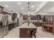 Well-appointed kitchen featuring granite countertops, modern appliances, and a central island with seating at 8441 W Foothill Dr, Peoria, AZ 85383