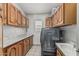 Laundry room with cabinets, counter, and appliances at 8441 W Foothill Dr, Peoria, AZ 85383