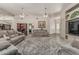 Comfortable living room area featuring plush sofas and an open layout, perfect for entertaining guests at 8441 W Foothill Dr, Peoria, AZ 85383