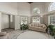 Bright living room with arched windows, fresh wall decor, and a cozy aesthetic at 8441 W Foothill Dr, Peoria, AZ 85383