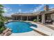 Pool features a diving board for active swimming with a stone patio at 8441 W Foothill Dr, Peoria, AZ 85383
