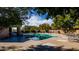 Community pool with mature shade trees and lounge chairs at 8502 E Cave Creek Rd # 61, Carefree, AZ 85377