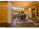 Well-lit dining area featuring a wooden table set on a patterned rug, adjacent to the modern kitchen at 8502 E Cave Creek Rd # 61, Carefree, AZ 85377