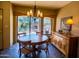 Charming dining area with decorative chandelier and outdoor patio view at 8502 E Cave Creek Rd # 61, Carefree, AZ 85377