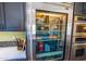 Contemporary kitchen with glass-front refrigerator and stainless steel appliances at 8502 E Cave Creek Rd # 61, Carefree, AZ 85377