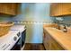 Practical laundry area with ample counter space and cabinets at 8502 E Cave Creek Rd # 61, Carefree, AZ 85377