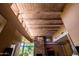 Living room with a fireplace, exposed ceiling beams, and high ceilings at 8502 E Cave Creek Rd # 61, Carefree, AZ 85377