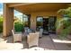 Covered patio with wicker seating, perfect for outdoor dining and relaxation at 8502 E Cave Creek Rd # 61, Carefree, AZ 85377