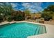 Pool with baja step descends to pool and features a raised sitting area with decorative pillows at 8502 E Cave Creek Rd # 61, Carefree, AZ 85377