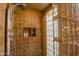 Shower features decorative tile surround, unique glass block and stainless steel shower fixtures at 8502 E Cave Creek Rd # 61, Carefree, AZ 85377