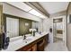Spacious bathroom featuring double sinks, granite countertops, and a separate shower at 9226 W Topeka Dr, Peoria, AZ 85382