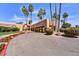 Clubhouse exterior featuring a covered entrance, desert landscaping, and ample parking, offering a welcoming ambiance at 9226 W Topeka Dr, Peoria, AZ 85382