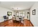 Bright dining room with hardwood floors and a chandelier at 9226 W Topeka Dr, Peoria, AZ 85382