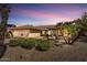 Beautiful single-story home featuring desert landscaping, a quaint porch, and a two-car garage at 9226 W Topeka Dr, Peoria, AZ 85382
