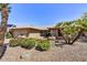 Beautiful single-story home featuring desert landscaping, a quaint porch, and a two-car garage at 9226 W Topeka Dr, Peoria, AZ 85382