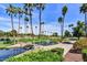 Scenic golf course with palm trees and tranquil water feature, creating a picturesque and relaxing atmosphere at 9226 W Topeka Dr, Peoria, AZ 85382