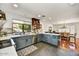 Modern kitchen featuring blue cabinets and stainless steel appliances at 9226 W Topeka Dr, Peoria, AZ 85382