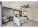 Comfortable main bedroom with a ceiling fan and serene ambiance at 9226 W Topeka Dr, Peoria, AZ 85382