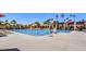 Large swimming pool with lap lanes, lounge chairs, and shaded areas, perfect for recreation and relaxation at 9226 W Topeka Dr, Peoria, AZ 85382