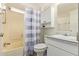 Bathroom features a tub with shower, toilet, and vanity with a mirror at 931 S 91St Pl, Mesa, AZ 85208