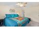 Calm bedroom offers a comfortable bed, closet, and simple, yet elegant décor at 931 S 91St Pl, Mesa, AZ 85208