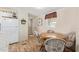 Cozy dining area featuring a round wooden table and chairs, bathed in natural light at 931 S 91St Pl, Mesa, AZ 85208