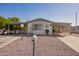 Single-story home with carport and desert landscaping at 931 S 91St Pl, Mesa, AZ 85208