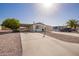 Single-story home with carport and desert landscaping at 931 S 91St Pl, Mesa, AZ 85208