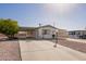 Single-story home with carport and desert landscaping at 931 S 91St Pl, Mesa, AZ 85208