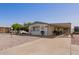 Single-story home with carport and desert landscaping at 931 S 91St Pl, Mesa, AZ 85208