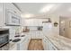 Well-equipped kitchen features a center island, ample cabinetry, and efficient appliances at 931 S 91St Pl, Mesa, AZ 85208