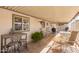 Inviting covered patio with seating, perfect for outdoor gatherings and relaxation, with fans and lighting at 931 S 91St Pl, Mesa, AZ 85208