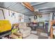 Shed interior with a variety of tools, seating, and storage containers for organized projects and hobbies at 931 S 91St Pl, Mesa, AZ 85208