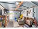 Shed interior with a variety of tools, seating, and storage containers for organized projects and hobbies at 931 S 91St Pl, Mesa, AZ 85208