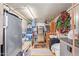 A packed storage area with ample room to store bins, luggage, chairs, camping gear and a secondary refrigerator at 931 S 91St Pl, Mesa, AZ 85208