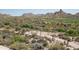 Residential area shows mountains, golf course, and houses at 9804 E Running Deer Trl, Scottsdale, AZ 85262