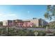 Contemporary home with desert landscaping, pink flowering bushes, and covered entry at 9828 E Running Deer Trl, Scottsdale, AZ 85262