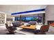 Open living room with modern furniture and fireplace at 9828 E Running Deer Trl, Scottsdale, AZ 85262