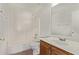 Bright bathroom featuring a shower-tub combination and a classic wood vanity at 11501 N Pablo St, El Mirage, AZ 85335