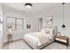 Stylishly furnished bedroom with a large window and tasteful decor, offering a comfortable retreat at 11501 N Pablo St, El Mirage, AZ 85335